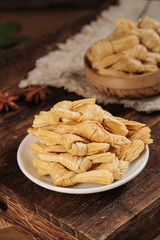 Handmade Bean Curd Skin Rolls Yuba Knots Traditional Asian Food on Wooden Table