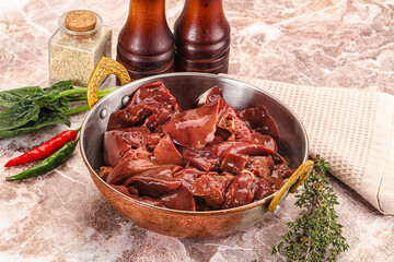 Raw uncokked chicken liver in the bowl