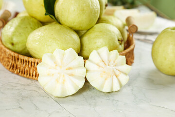 Fresh White Guavas in Basket with Sliced Soft Cream-Centered Tropical Fruit