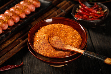 Guizhou Chili Powder BBQ Seasoning Base with Dried Peppers and Sausages on Wooden Table