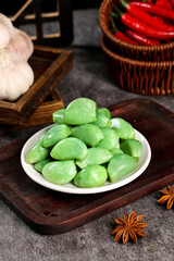 Fresh Green Olives with Mediterranean Cooking Ingredients - Garlic, Peppers and Spices on Rustic Wooden Background