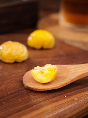Golden Chestnut Kernels on Wooden Spoon - Fresh Roasted Nuts Ready for Cooking