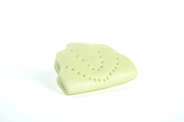 Handmade Green Soap Bar with Ruffled Texture and Decorative Pattern on White Background
