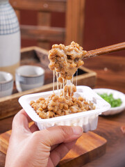 Japanese Natto Fermented Soybeans with Chopsticks Showing Sticky Texture Traditional Asian Food