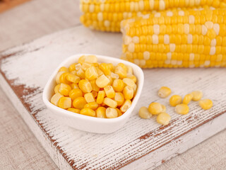 Fresh Sweet Corn Kernels and Cobs from Yunnan on Rustic Wooden Background