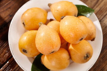Fresh Loquat Fruits on White Plate - Asian Alpine Fruit Display
