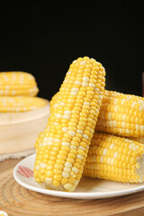 Fresh Golden Corn Cobs on White Plate - Sweet Yellow Kernels Ready to Eat