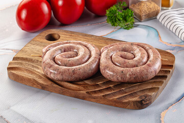Raw meat pork and beef swirl sausages