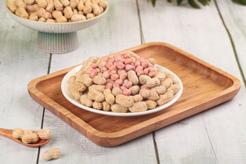 Raw Peanuts with Red Skin Kernels on Wooden Tray - Healthy Snack Ingredients