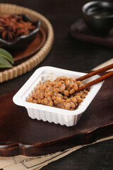 Japanese Natto Fermented Soybeans in Container with Chopsticks Traditional Asian Food
