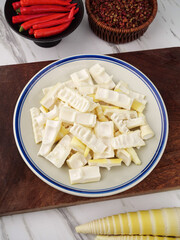Freshly Dug Spring Bamboo Shoots Prepared for Asian Cooking with Red Peppers and Spices