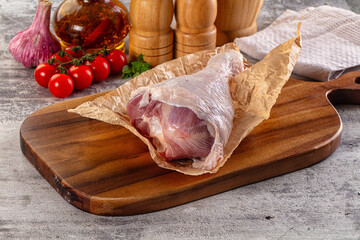 Raw uncooked turkey leg drumstick