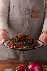 Chef Serving Traditional Braised Red Cabbage with Dried Fruits - Homestyle Cooking