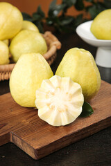 Fresh White Guava Fruit with Creamy Flesh Cross-Section on Wooden Board - Tropical Healthy Food Photography