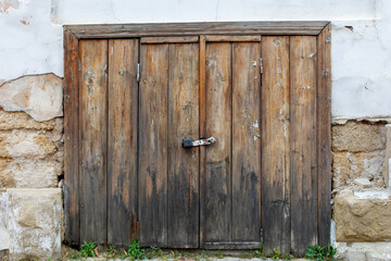 A wooden door with a lock on it