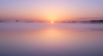 Serene sunrise over misty lake with soft pastel sky and tranquil water reflection