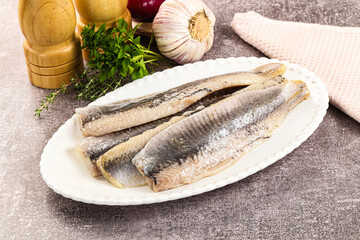 Marinated salted herring fillet apetizer