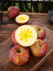 Fresh Red Apples with Star Pattern Core on Wooden Cutting Board - Natural Fruit Cross Section