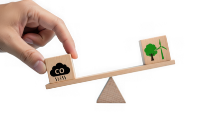 Hand balancing wooden blocks representing co2 emissions and a wind turbine on a seesaw, isolated on transparent background