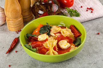 Italian pasta farfalle with pepperoni