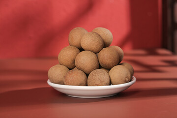 Fresh Longan Fruits on White Plate - Traditional Asian Tropical Produce Display
