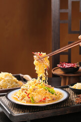 Braised Pork with Sauerkraut Dumplings and Noodles - Traditional Asian Cuisine on White Plate