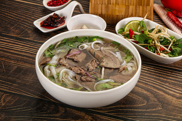 Vietnamese Pho Bo soup with beef and noodles