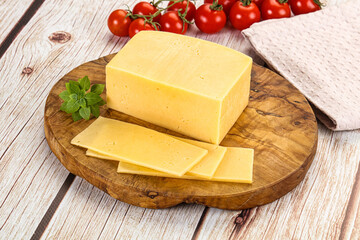 Yellow cheese piece with slices