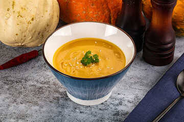 Vegan pumpkin cream soup served sesam