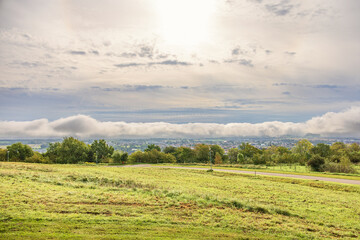 Scenic landscape view with rain clouds in the sky