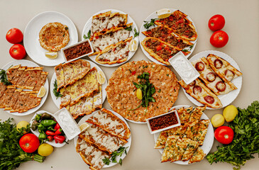 Delicious meat kebab with fresh vegetable salad served with variety of Turkish dishes and appetizers. Top view of assorted Turkish food and meze, tasty and healthy Mediterranean cuisine. Top view.