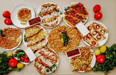 Delicious meat kebab with fresh vegetable salad served with variety of Turkish dishes and appetizers. Top view of assorted Turkish food and meze, tasty and healthy Mediterranean cuisine. Top view.