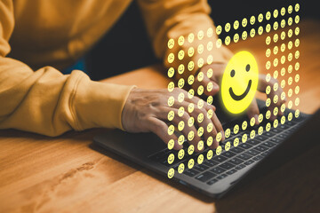 Customer feedback and satisfaction concept with smiling face icons on laptop, symbolizing positive...
