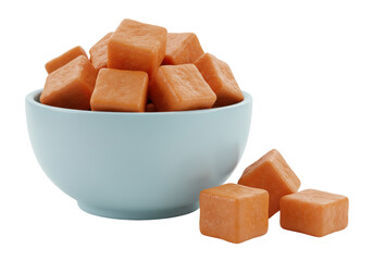 Isolated bowl of orange cubes against a plain background for sweet treats & healthy snacks