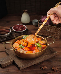 Hot Pot Shabu Shabu with Tofu and Vegetables - Traditional Asian Cuisine with Chopsticks