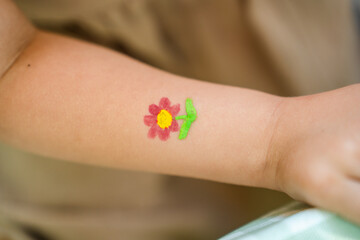 Flower pattern on a child's hand
