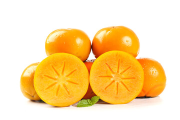 Fresh Persimmons Cut in Half Showing Star Pattern on White Background