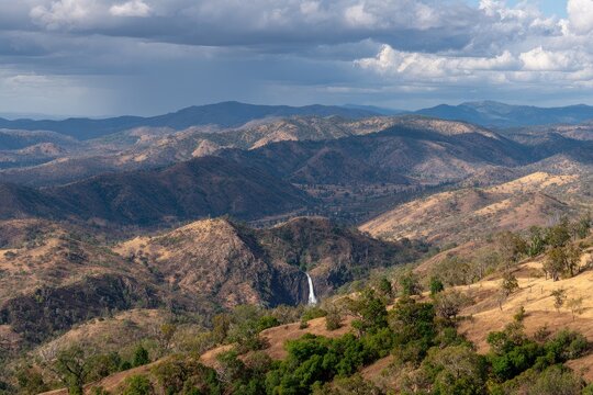 Panoramic mountain vista with waterfall