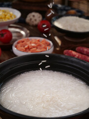Wuchang Fragrant Rice Porridge Cooking with Traditional Chinese Ingredients and Side Dishes