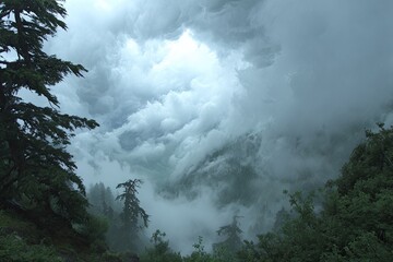 Misty mountain vista with dense clouds