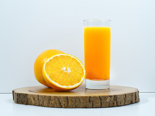 Close-up, orange juice on wooden board, nutritious and healthy, white background