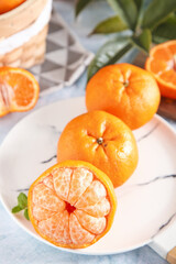 Fresh Peeled Oranges and Citrus Segments on White Marble Background