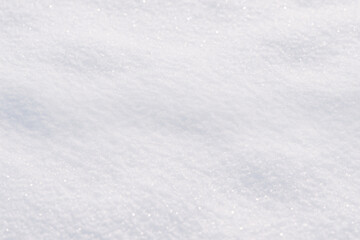 Fototapeta premium Photorealistic texture of fresh white snow with soft natural light and delicate sparkling crystals. Clean winter background, ideal for seasonal designs and holiday promotions.