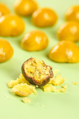 Roasted Alpine Chestnuts from Yunnan China with Golden Shells and Creamy Flesh on Green Background