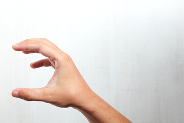 close up of man's hand holding small item Isolated on white background