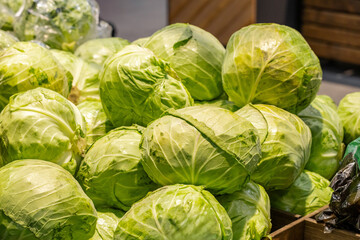 Cabbage background in market. Fresh cabbage on natural light.