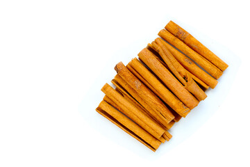 Dried cinnamon sticks arranged in a bundle.