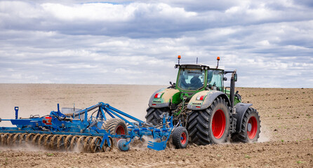 Fototapeta premium Trailer Hitch for tractors and combines. Trailers for agricultural machinery. Disc harrow Cultivator for agricultural machinery for tractors