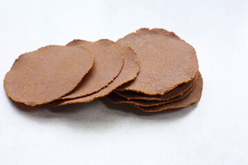 Sun-dried fermented soybean sheets called “Thua Nao,” a traditional ingredient in Northern Thai cooking.