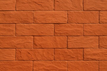 Obraz premium A solid wall of neatly laid red stone blocks. This clean, uniform texture is ideal for architecture, design, and surface backgrounds.